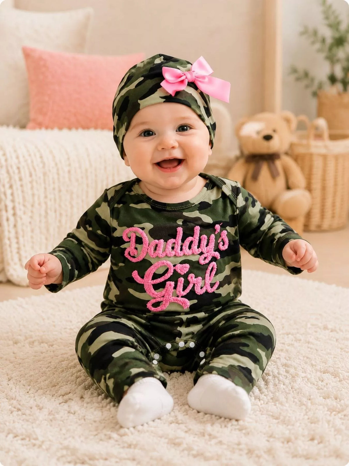 Jumpsuit and hat on a seated baby