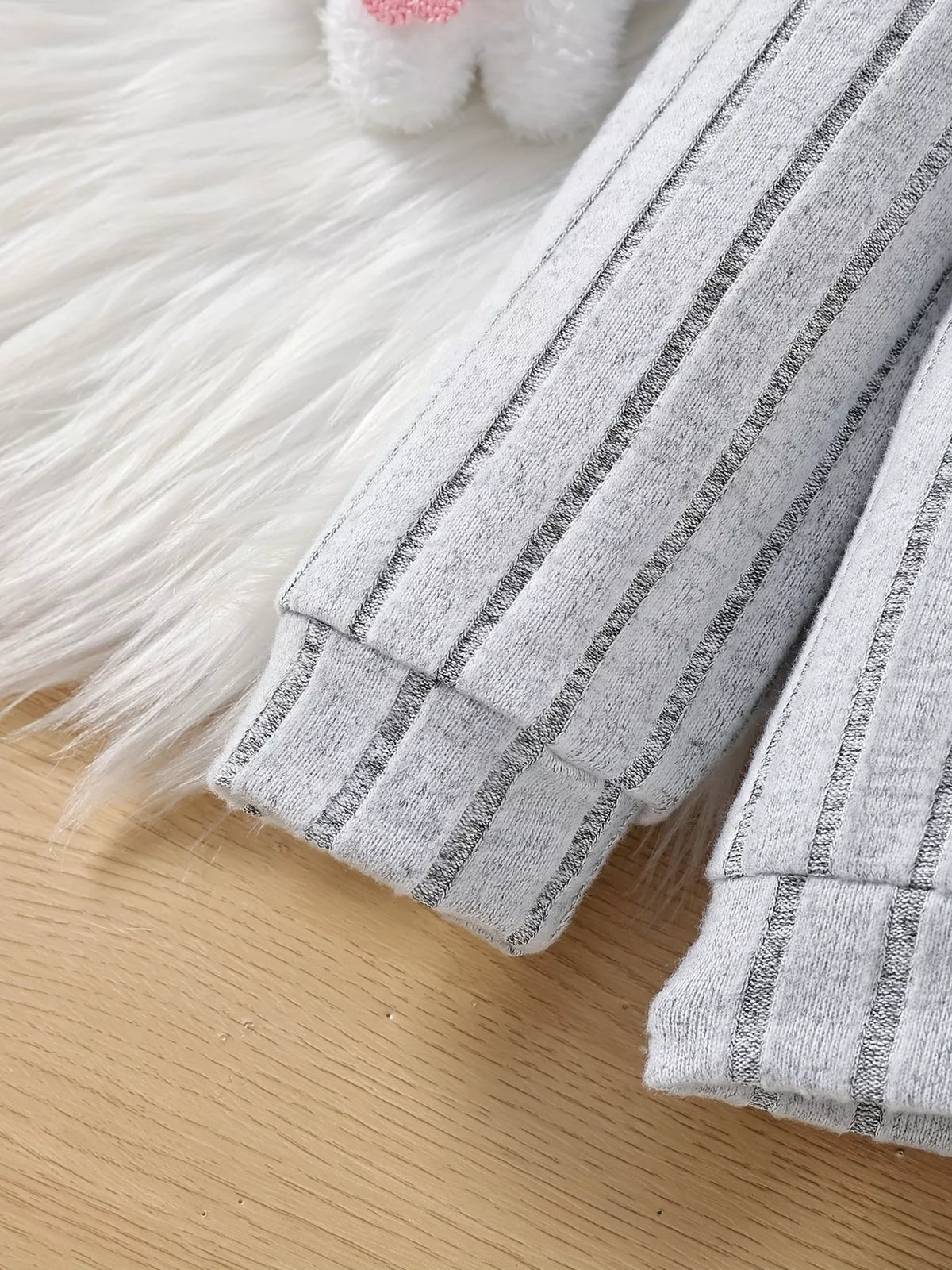 Gray ribbed sleeve cuffs
