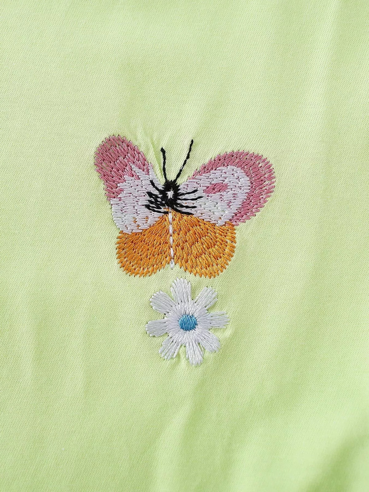 Embroidered butterfly and small blue flower