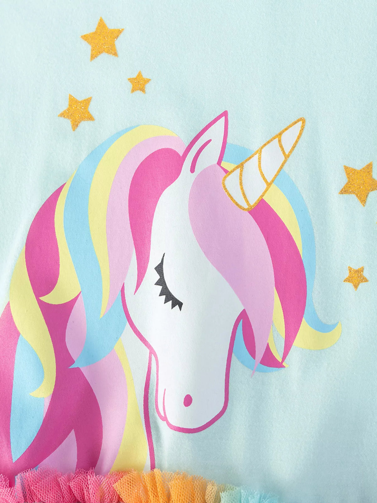 Unicorn head with rainbow mane and gold stars
