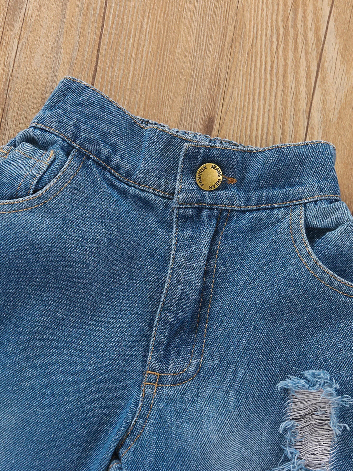 Jeans waistband with gold-tone button