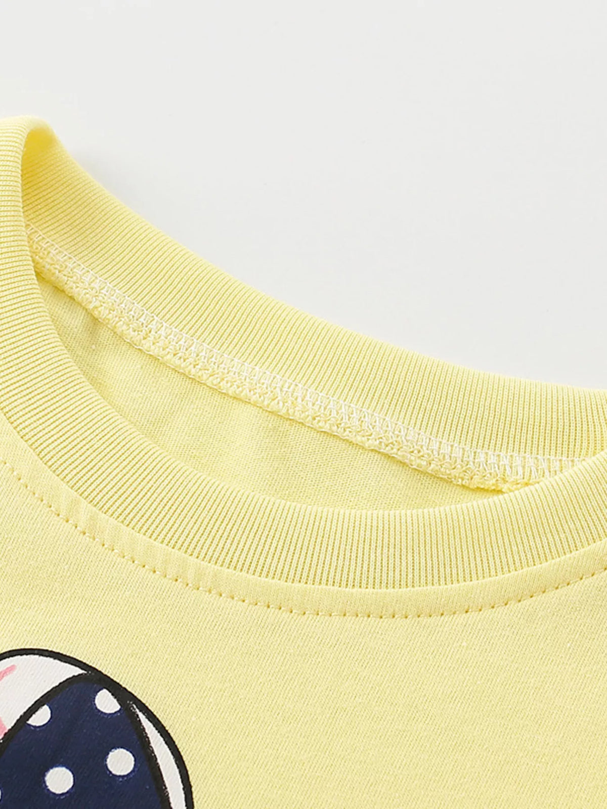Yellow bicycle bunny graphic shirt — round neckline