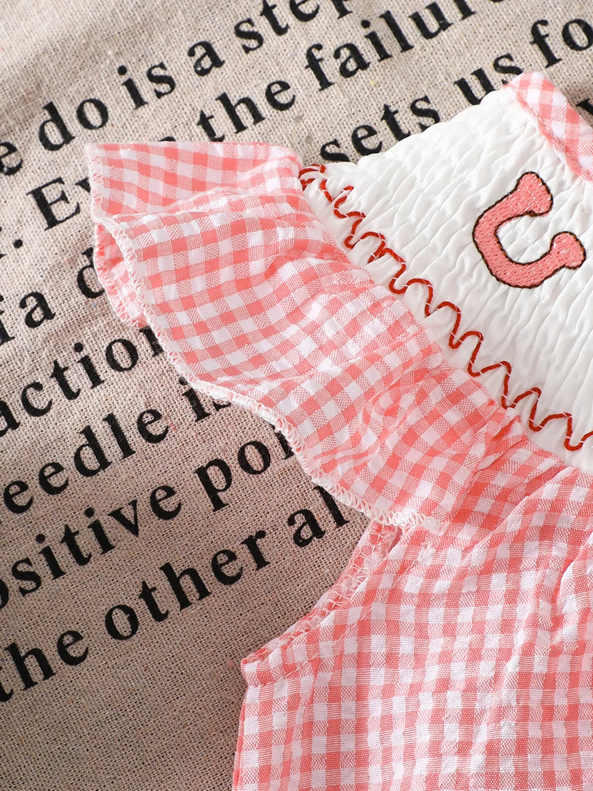 Gingham shoulder ruffle with pink edging