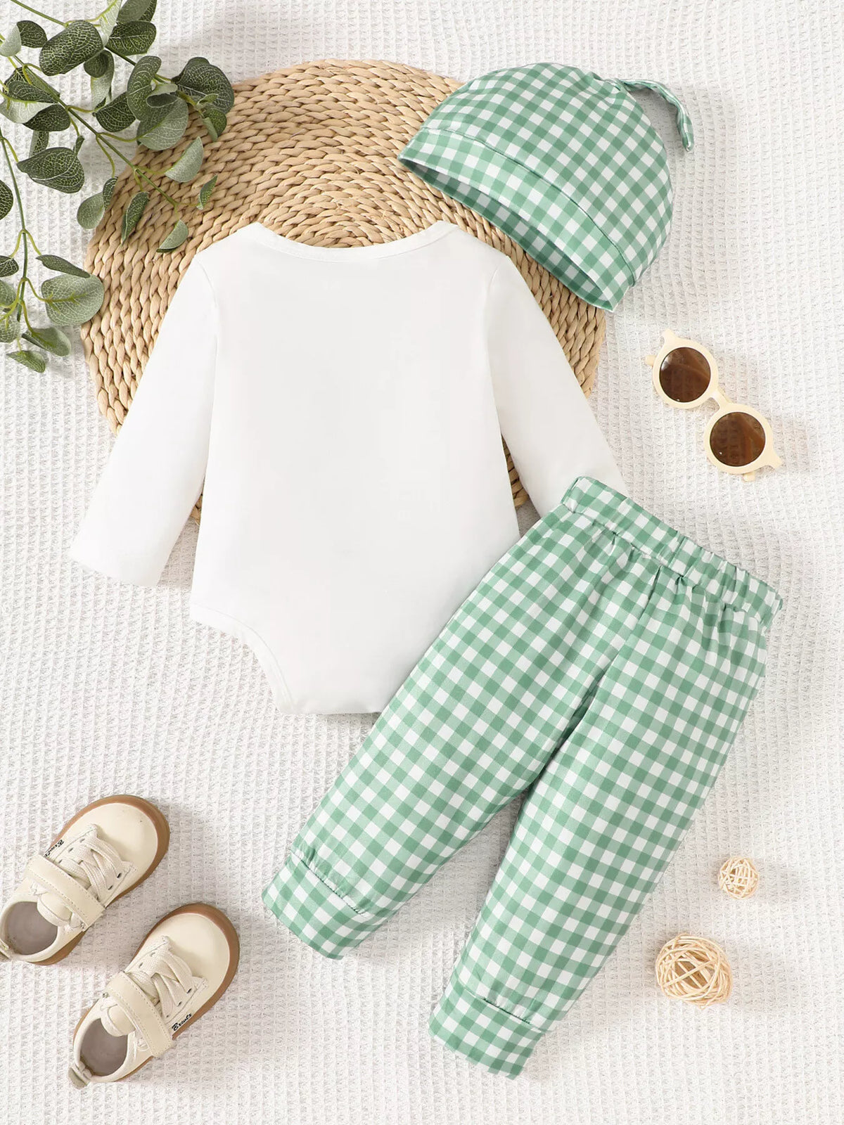 Back of the white bodysuit and green gingham pants with hat