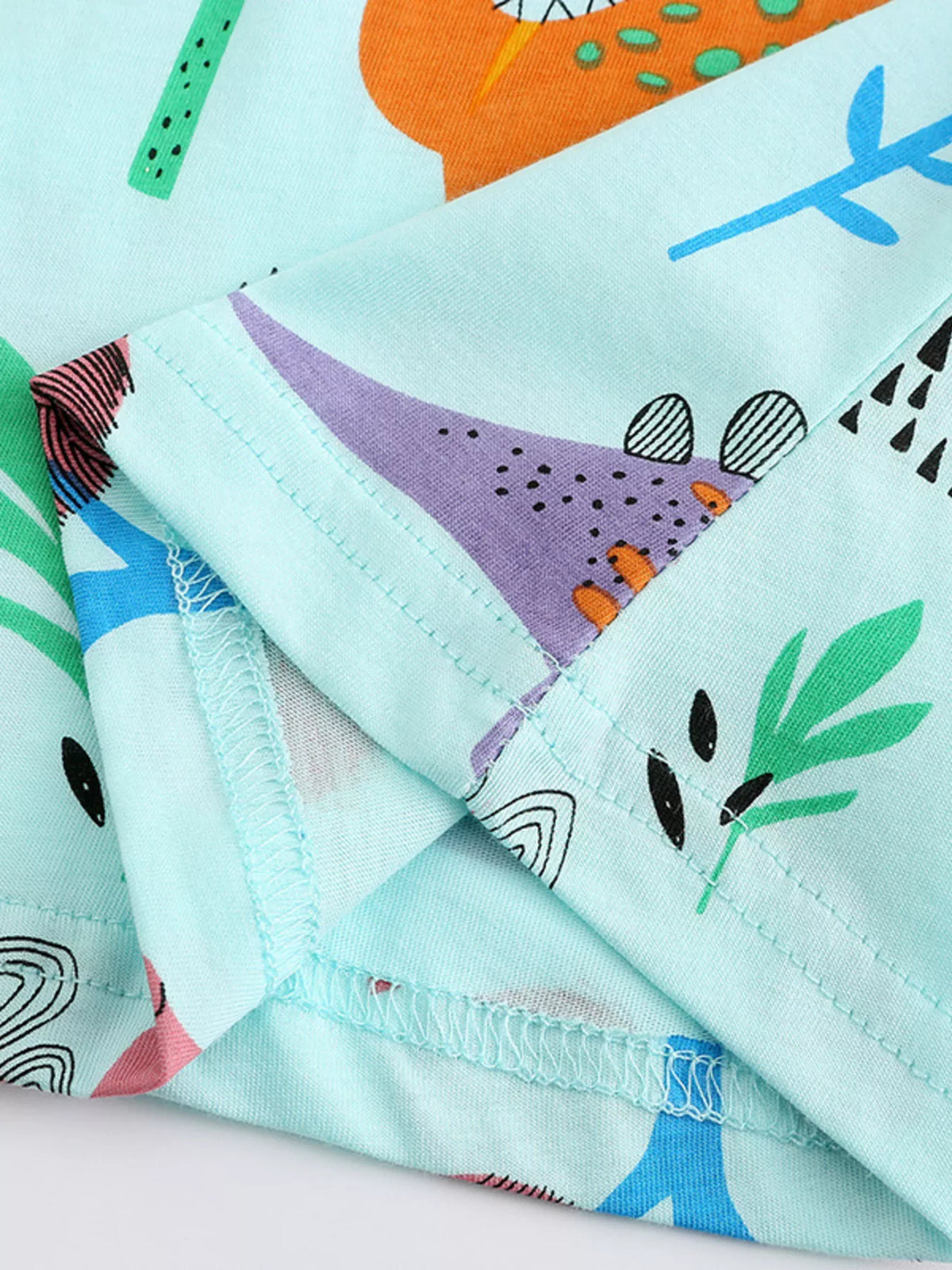 Aqua Dinosaur Print A-Line Dress — sleeve fabric detail