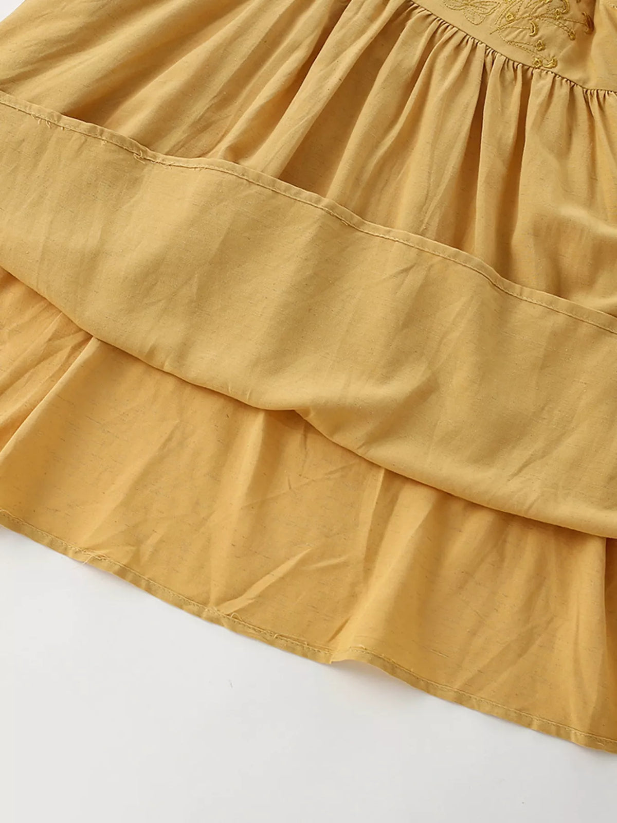 Gathered mustard skirt and tier seam