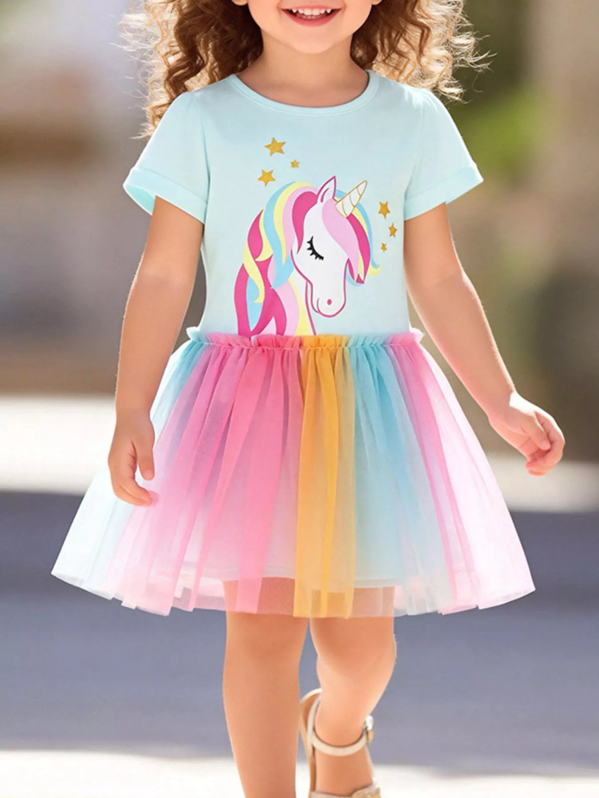 Mint unicorn dress with a rainbow tulle skirt on a child