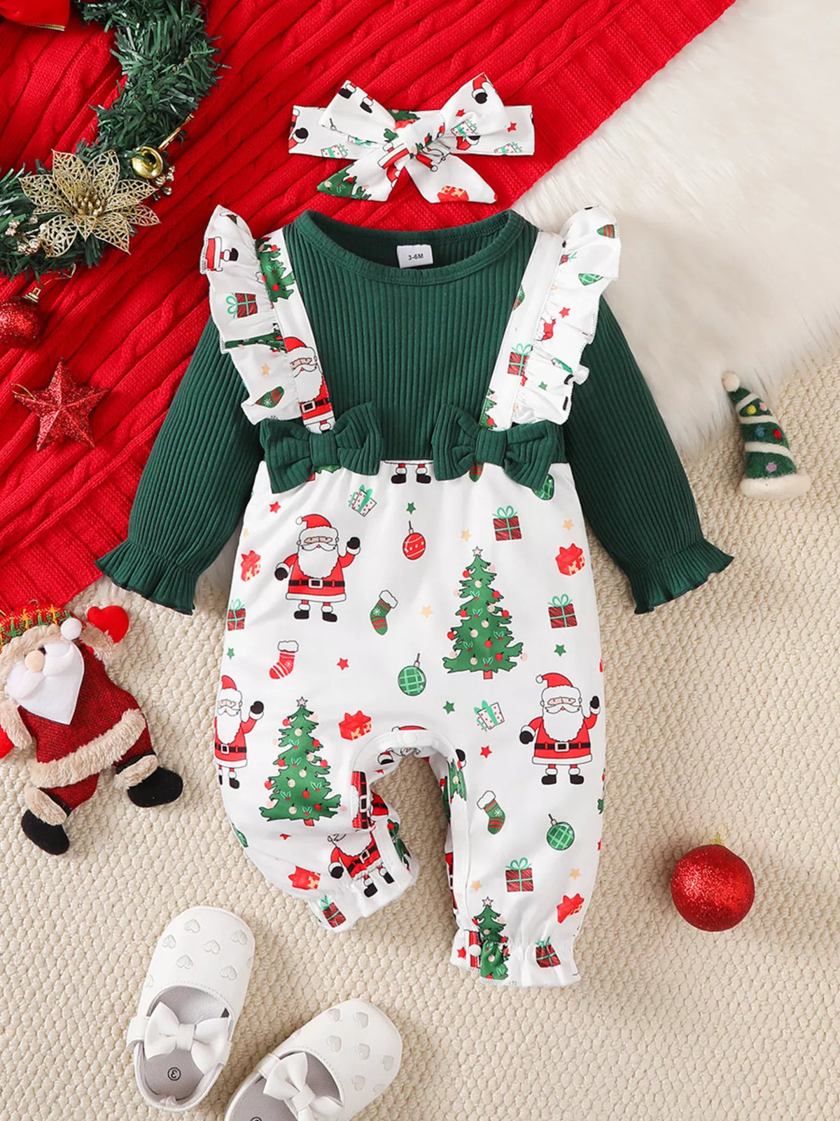 Green ribbed and Santa print jumpsuit set with bow headband — full outfit with headband laid flat