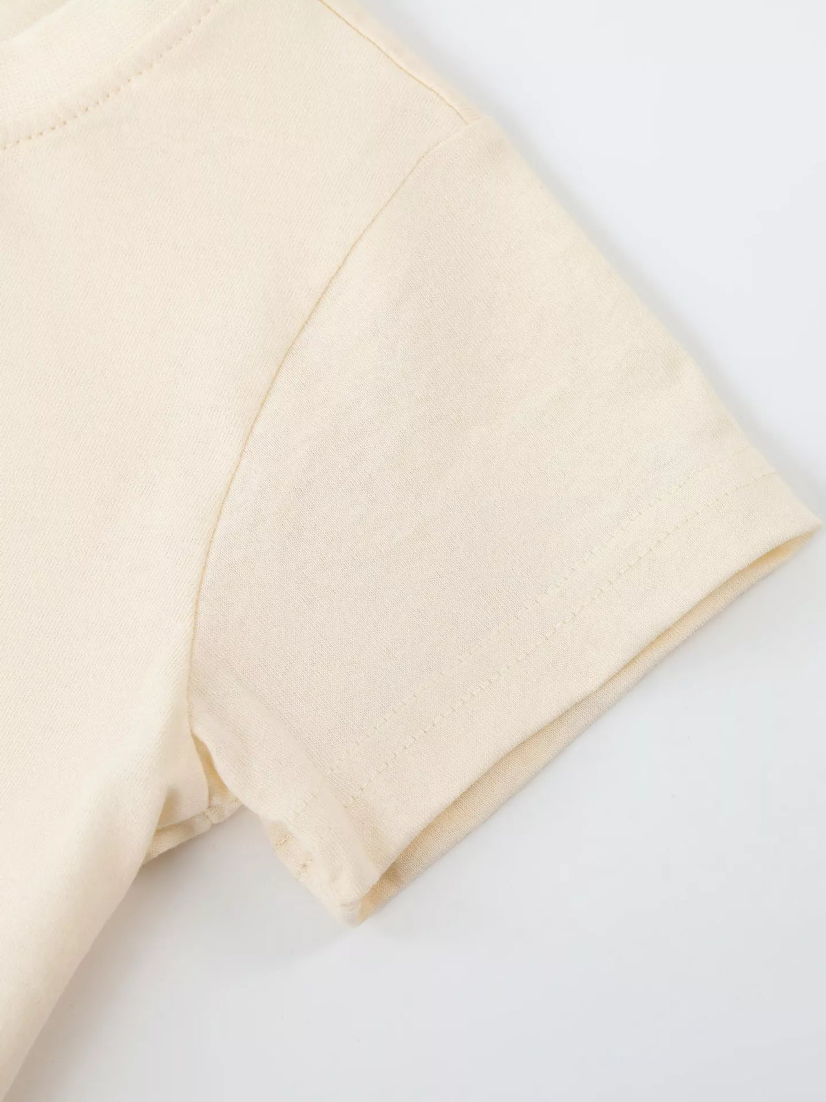 Cream short sleeve and stitched hem