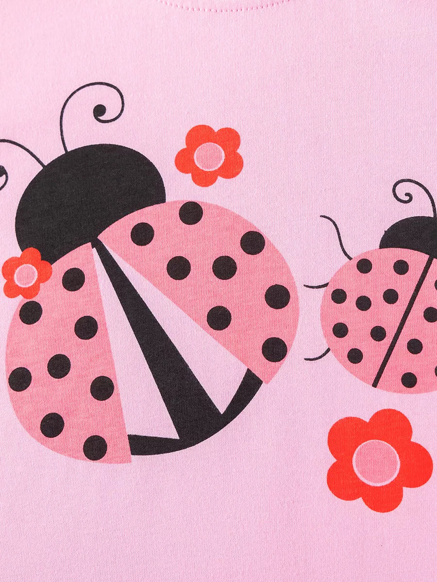 Pink-and-black ladybugs and small red flowers