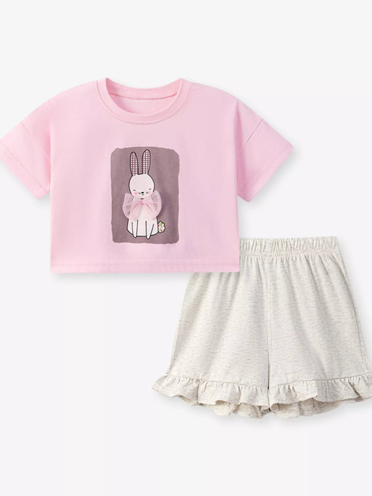 Pink bunny tee with pale ruffle-hem shorts laid flat
