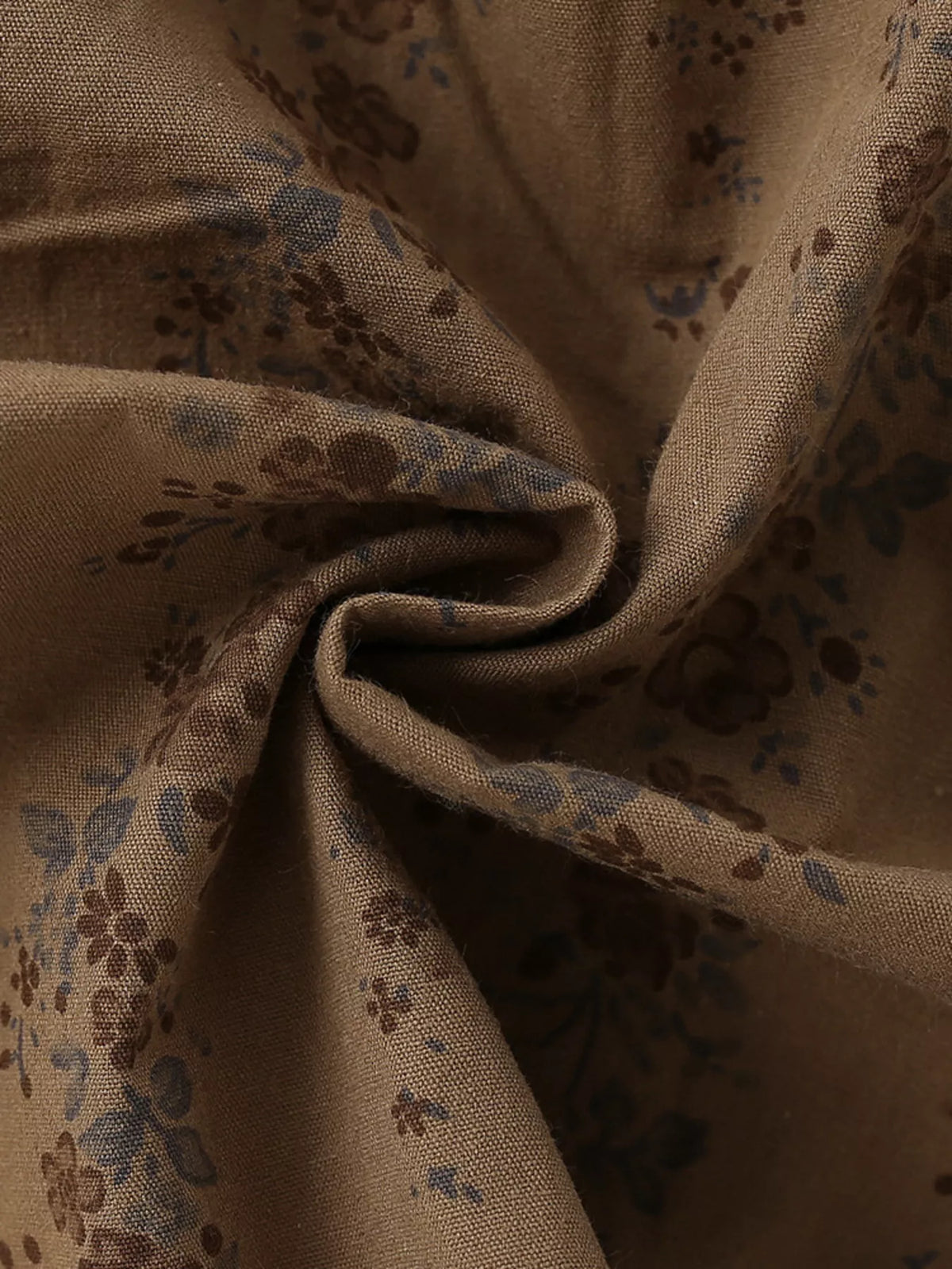 Small floral print on brown fabric
