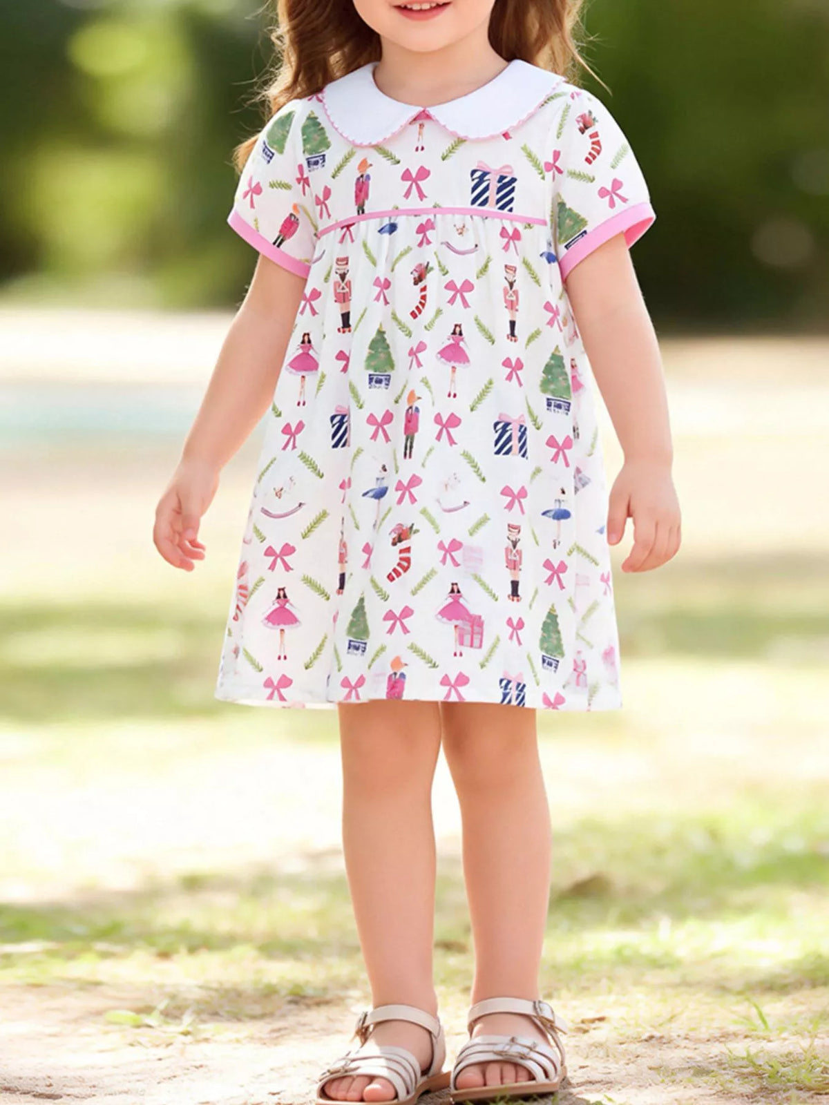 White Christmas-print dress with a Peter Pan collar on a child