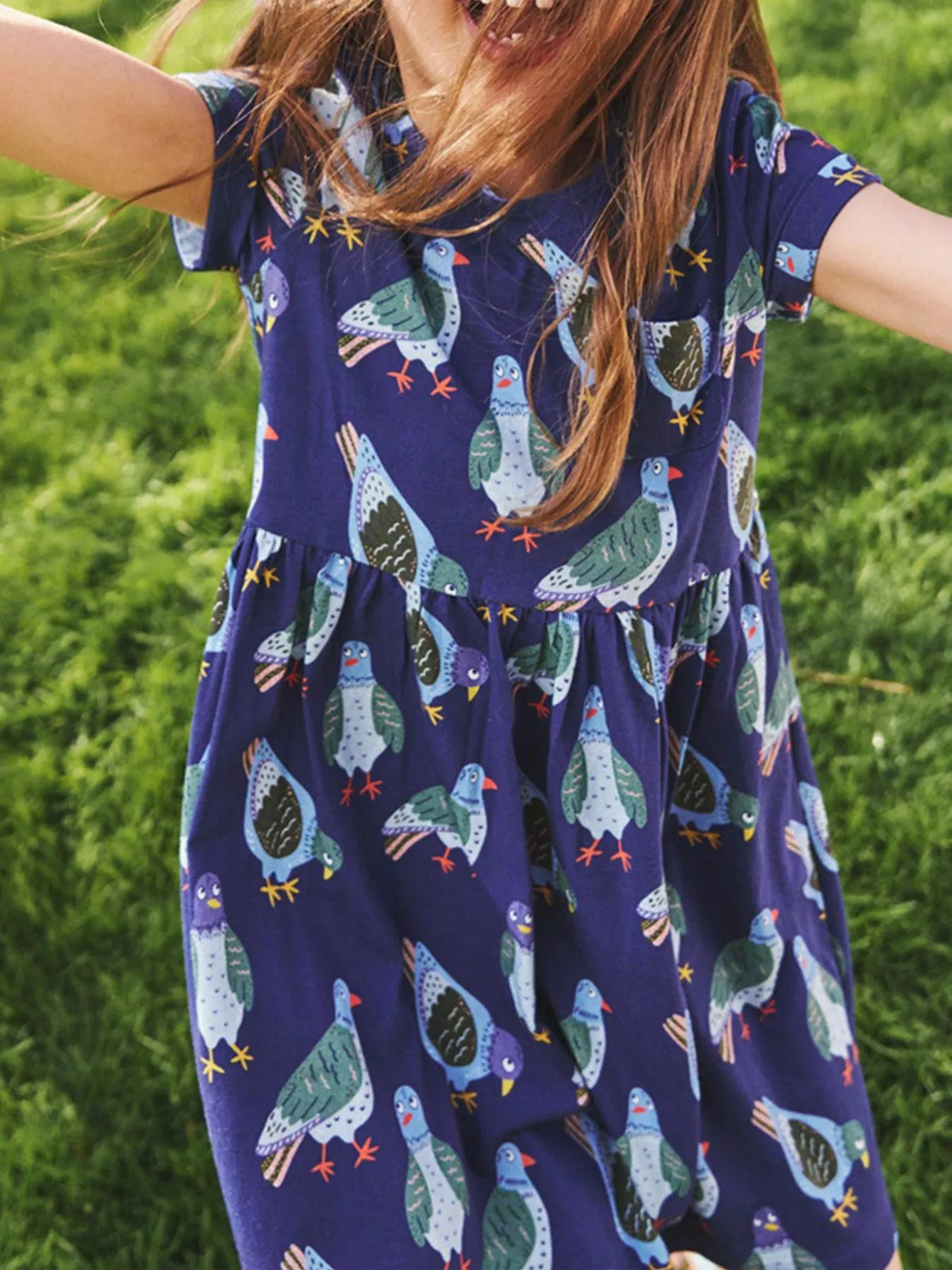 Navy Pigeon Print Cotton Dress — dress worn by a child