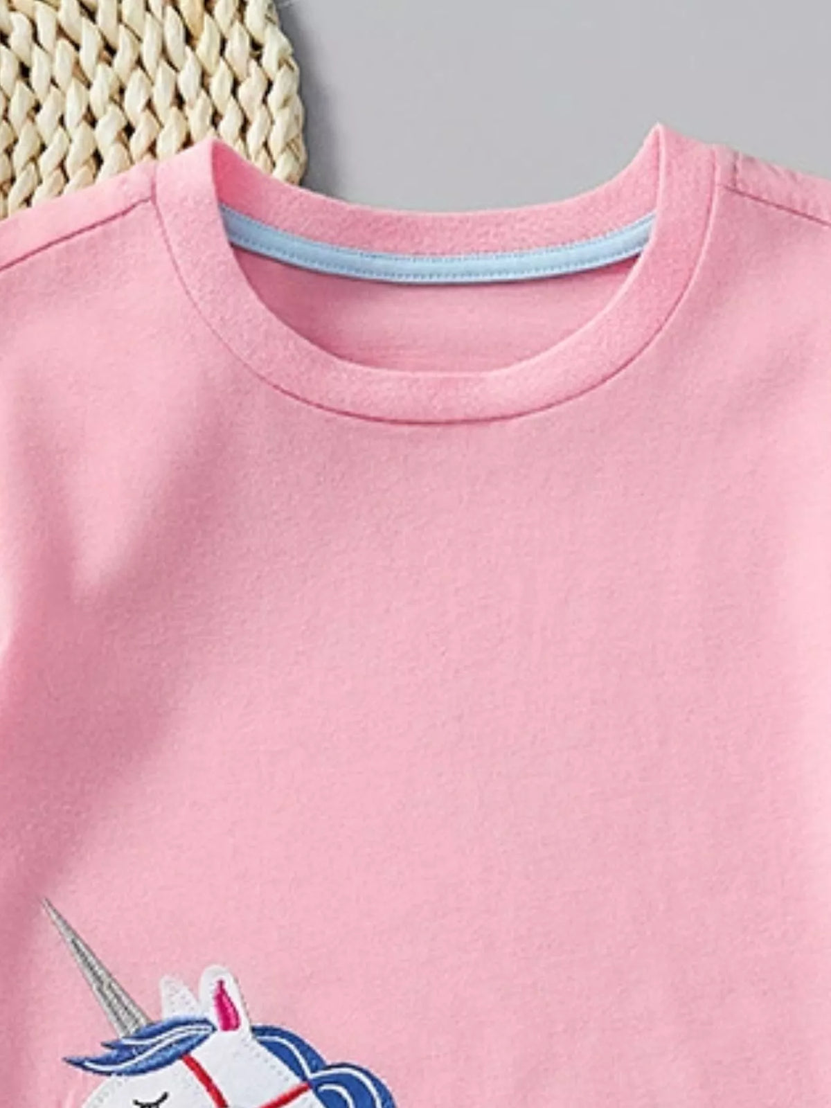 Pink unicorn applique flutter sleeve shirt — round neckline with blue inner tape