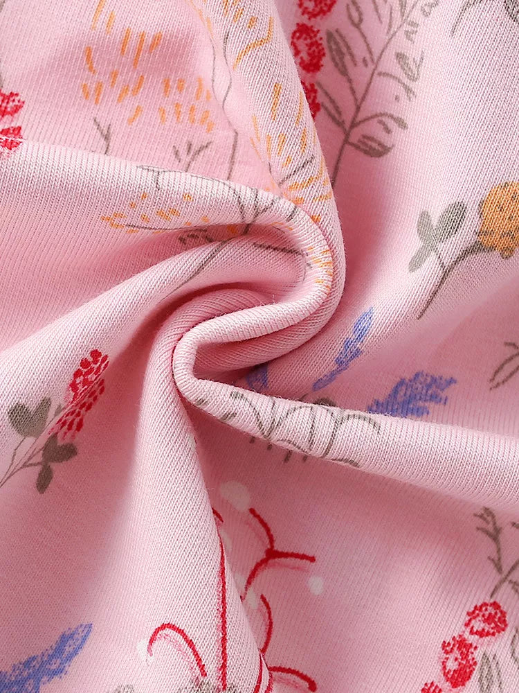 Small multicolored flowers on pink fabric
