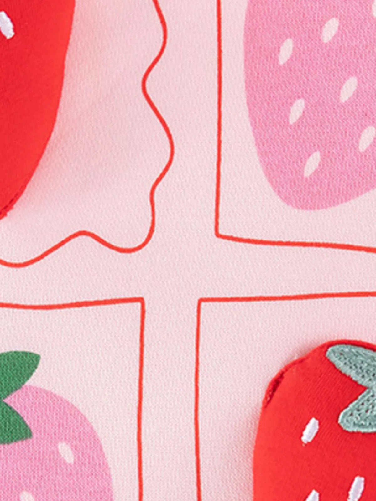 Red and pink strawberry print close-up