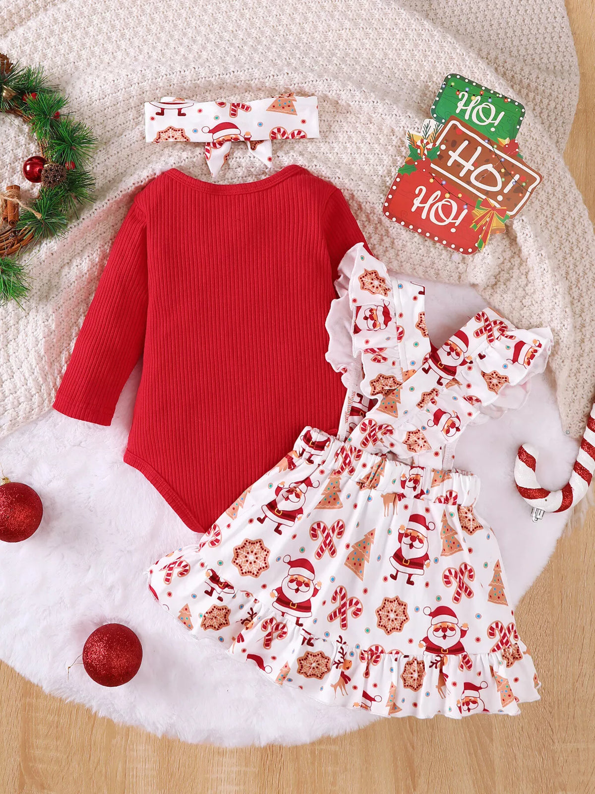 Red ribbed bodysuit Santa suspender skirt and headband — outfit back