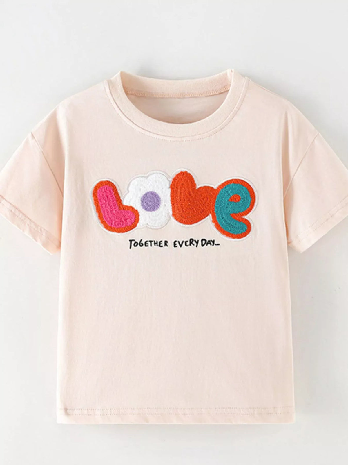 Peach LOVE applique shirt — front laid flat