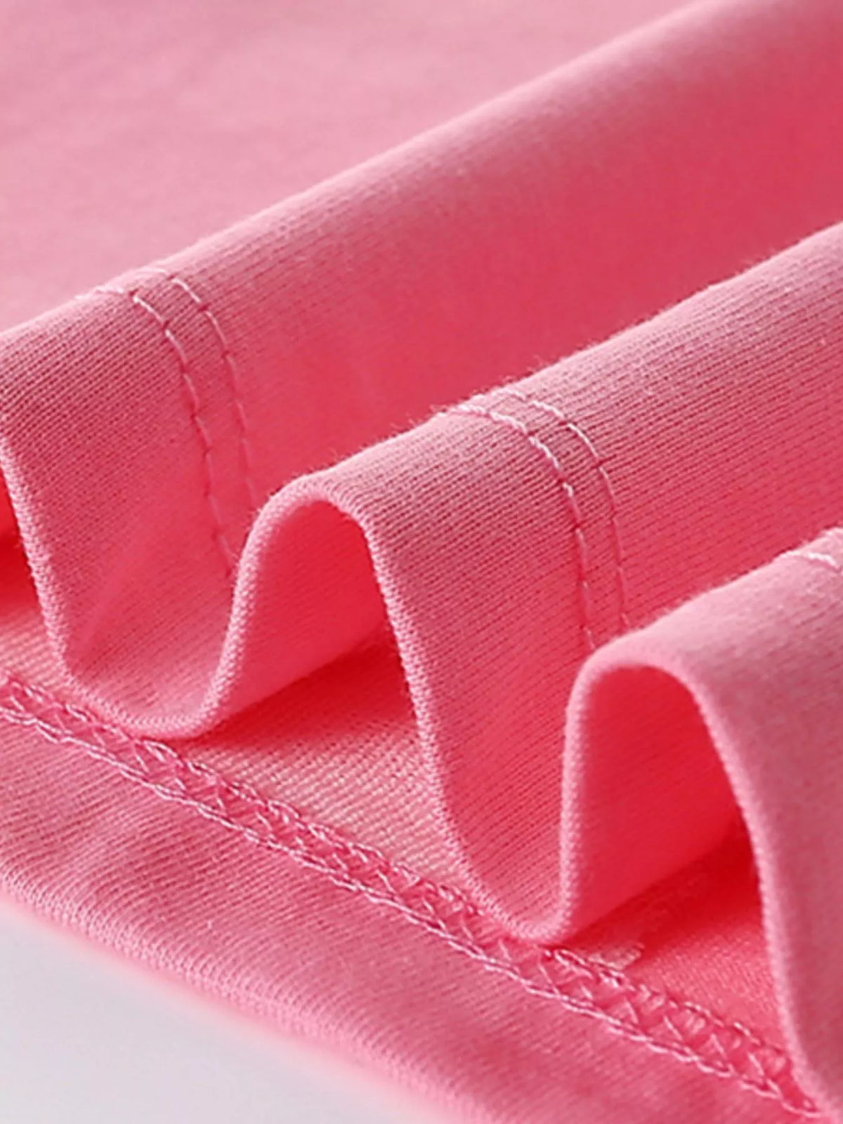 Pink lion and butterfly applique shirt — hem stitching