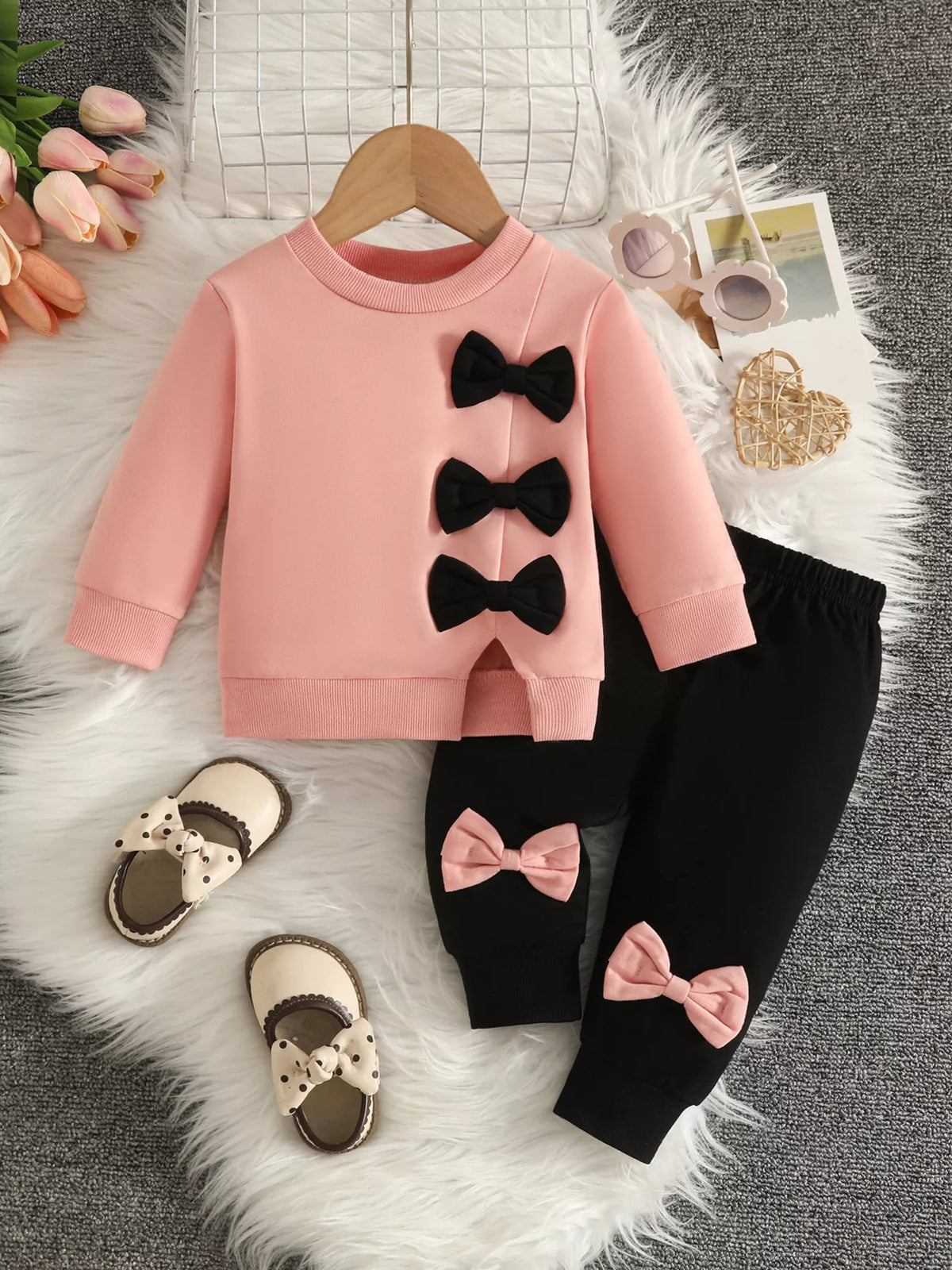 Bow embellished sweatshirt and black pants set — pink outfit front