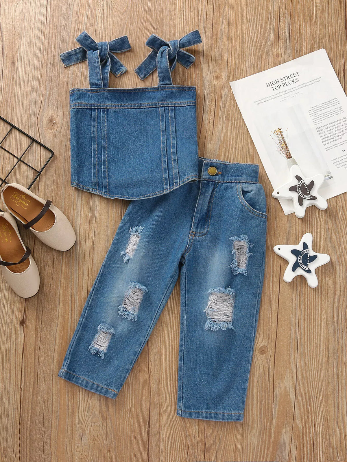 Denim tie-shoulder tank with distressed jeans laid flat