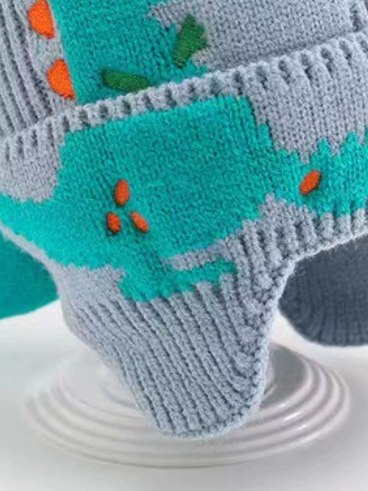 Dinosaur Knit Hat with Earflaps — blue hat earflap and dinosaur detail