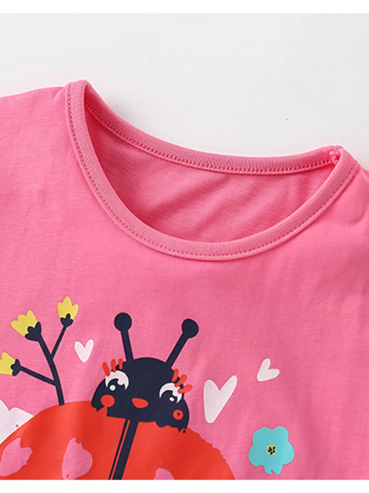 Hot pink ladybug flower graphic ruffle sleeve shirt — round neckline