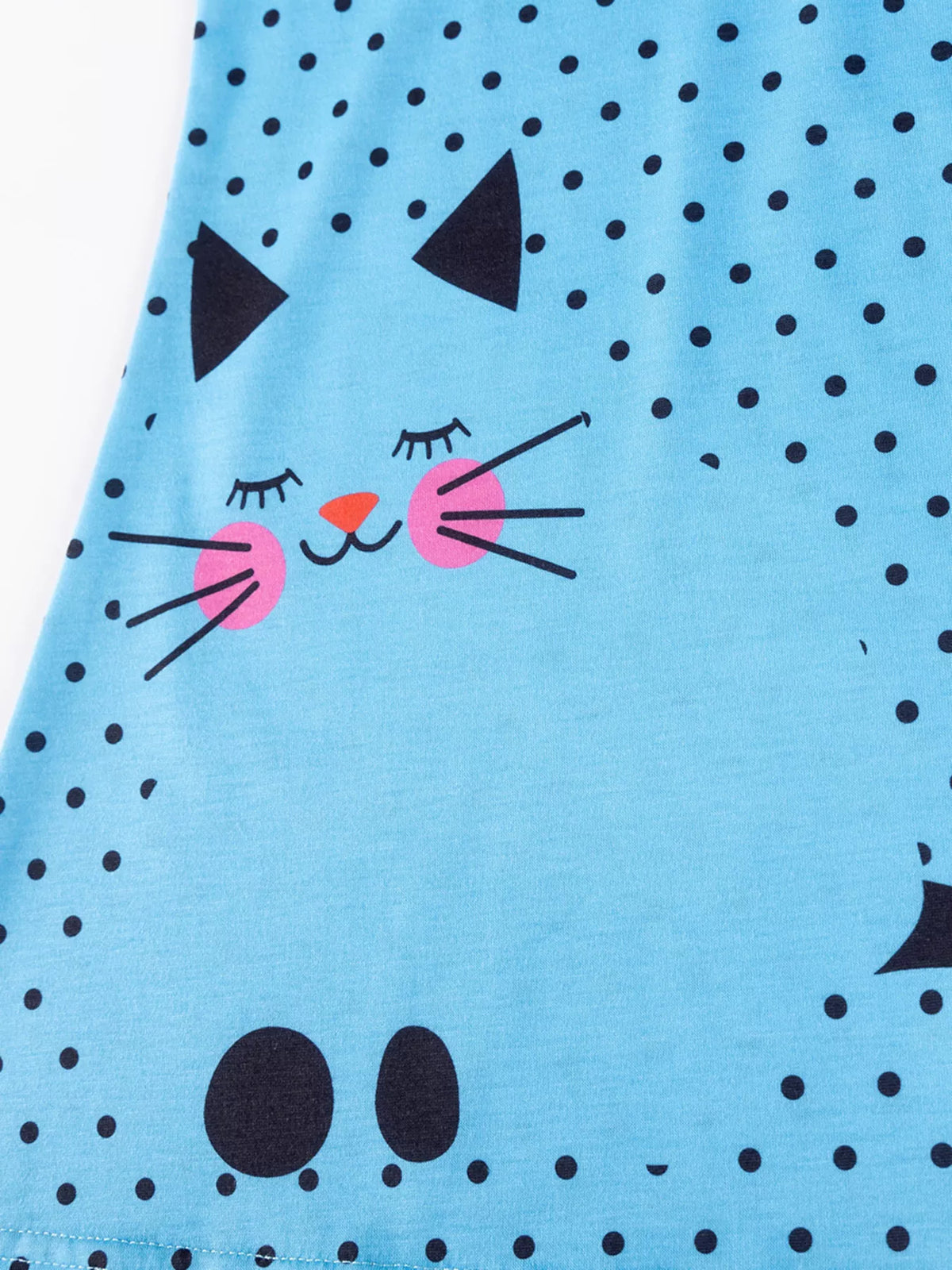 Large cat graphic near the dress hem
