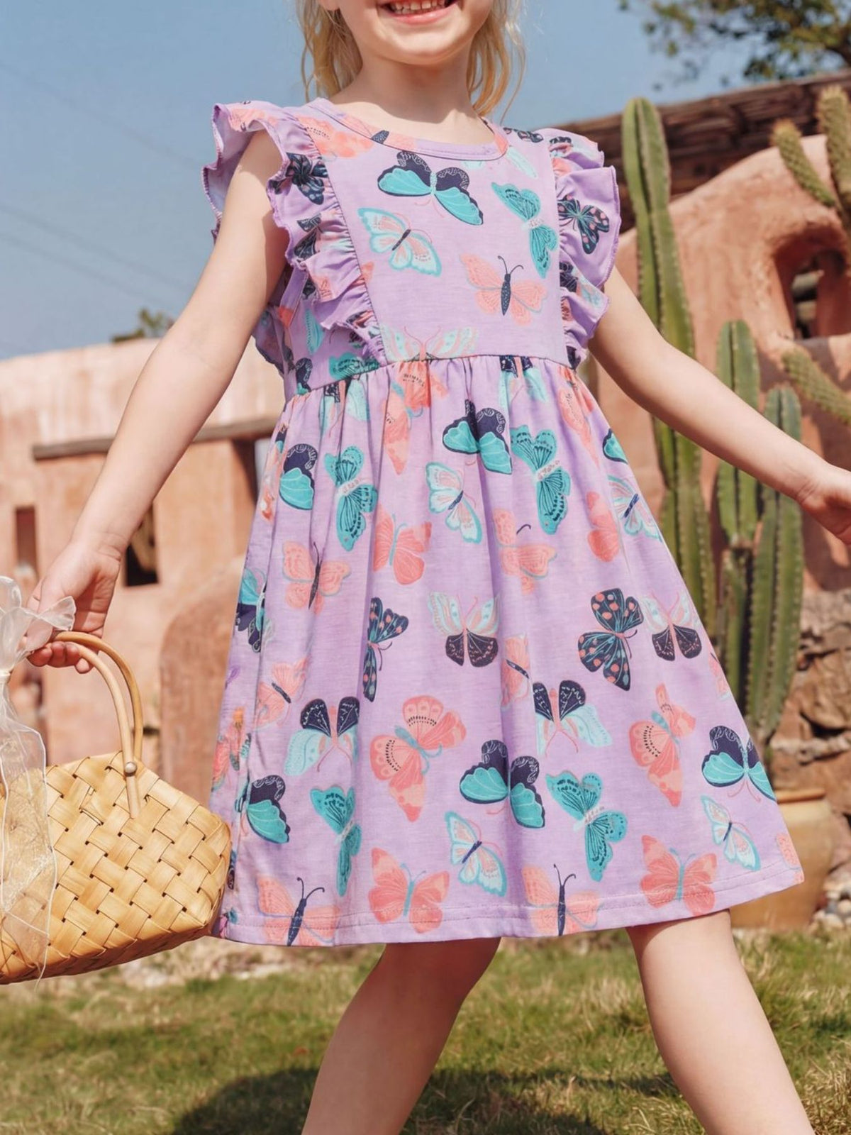 Purple Butterfly Ruffle Sleeve Dress — dress worn by a child