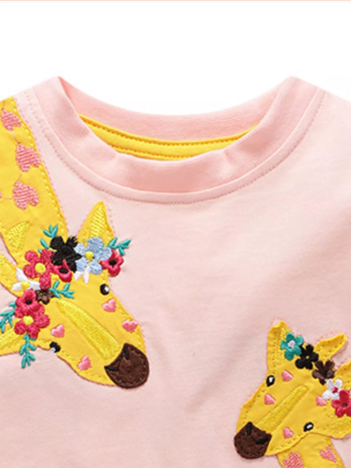 Pink floral giraffe applique shirt — round neckline and giraffe detail