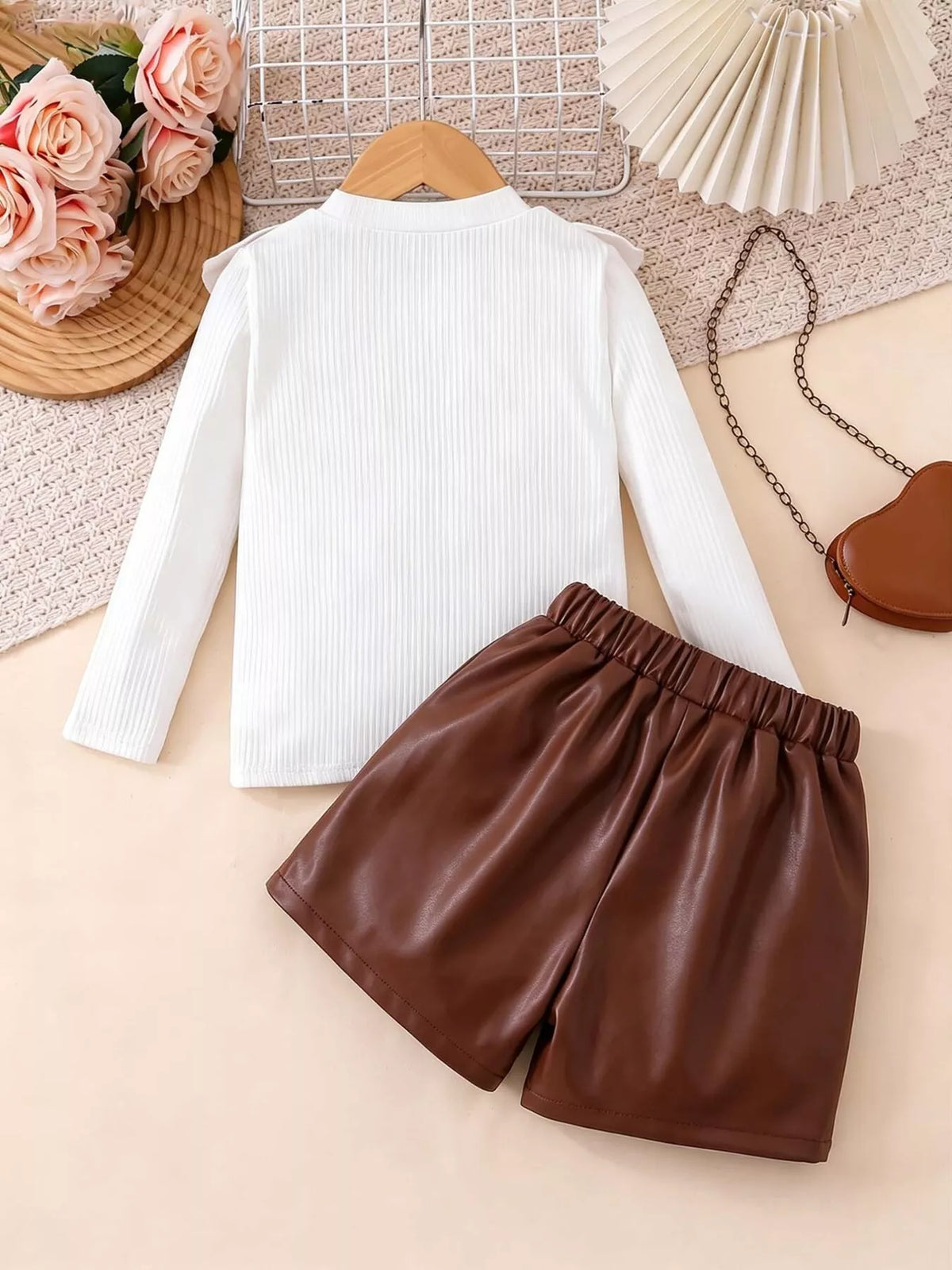 Back of the white top and brown skirt