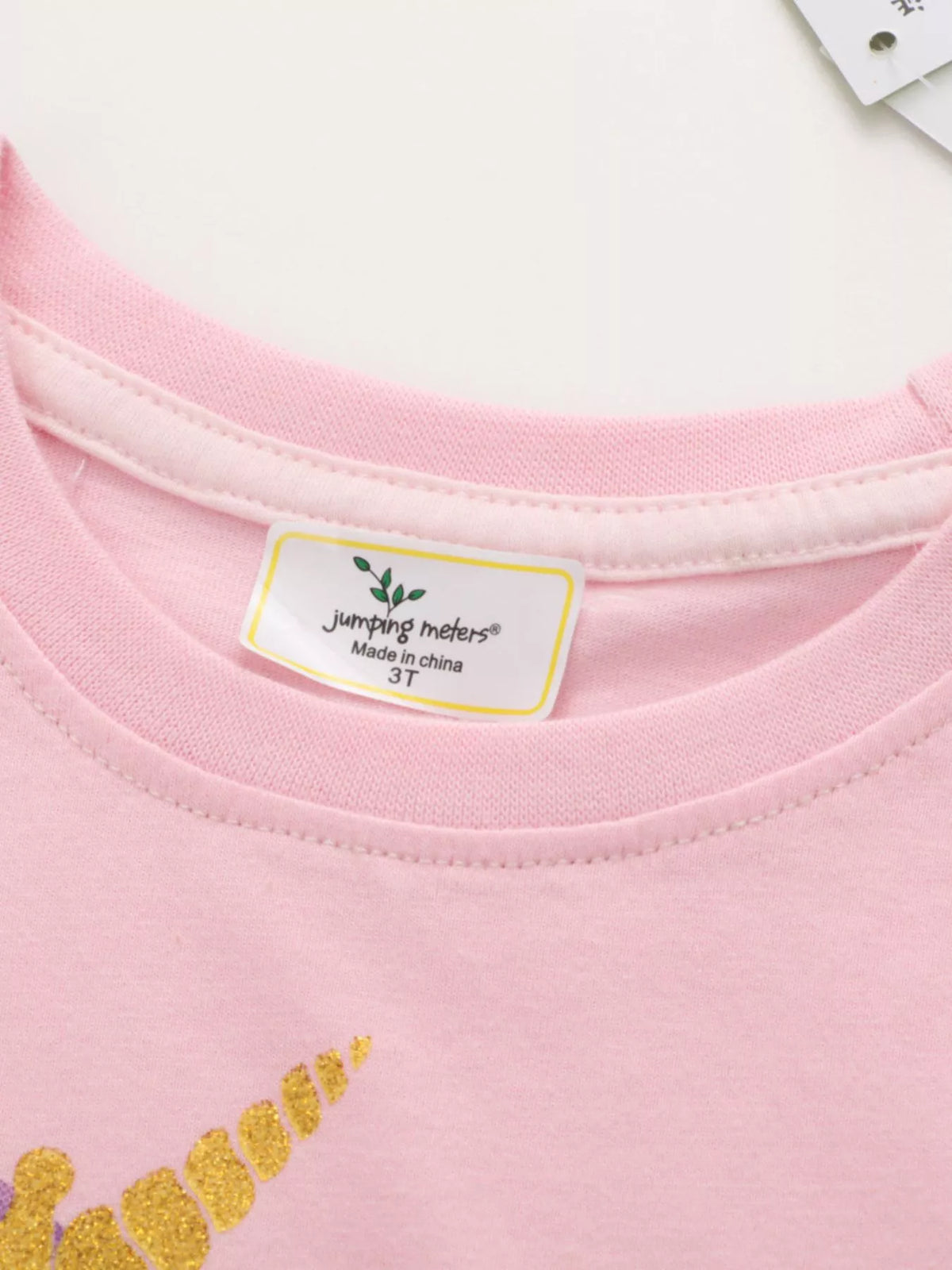 Pink winged unicorn graphic shirt — round neckline