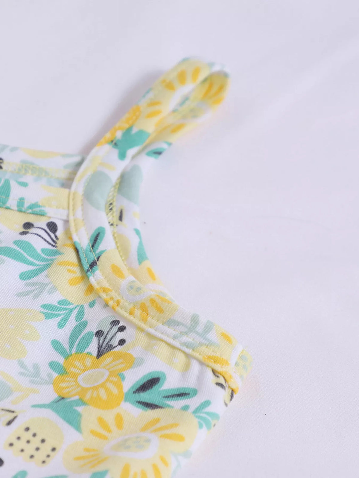 Thin floral shoulder strap and neckline