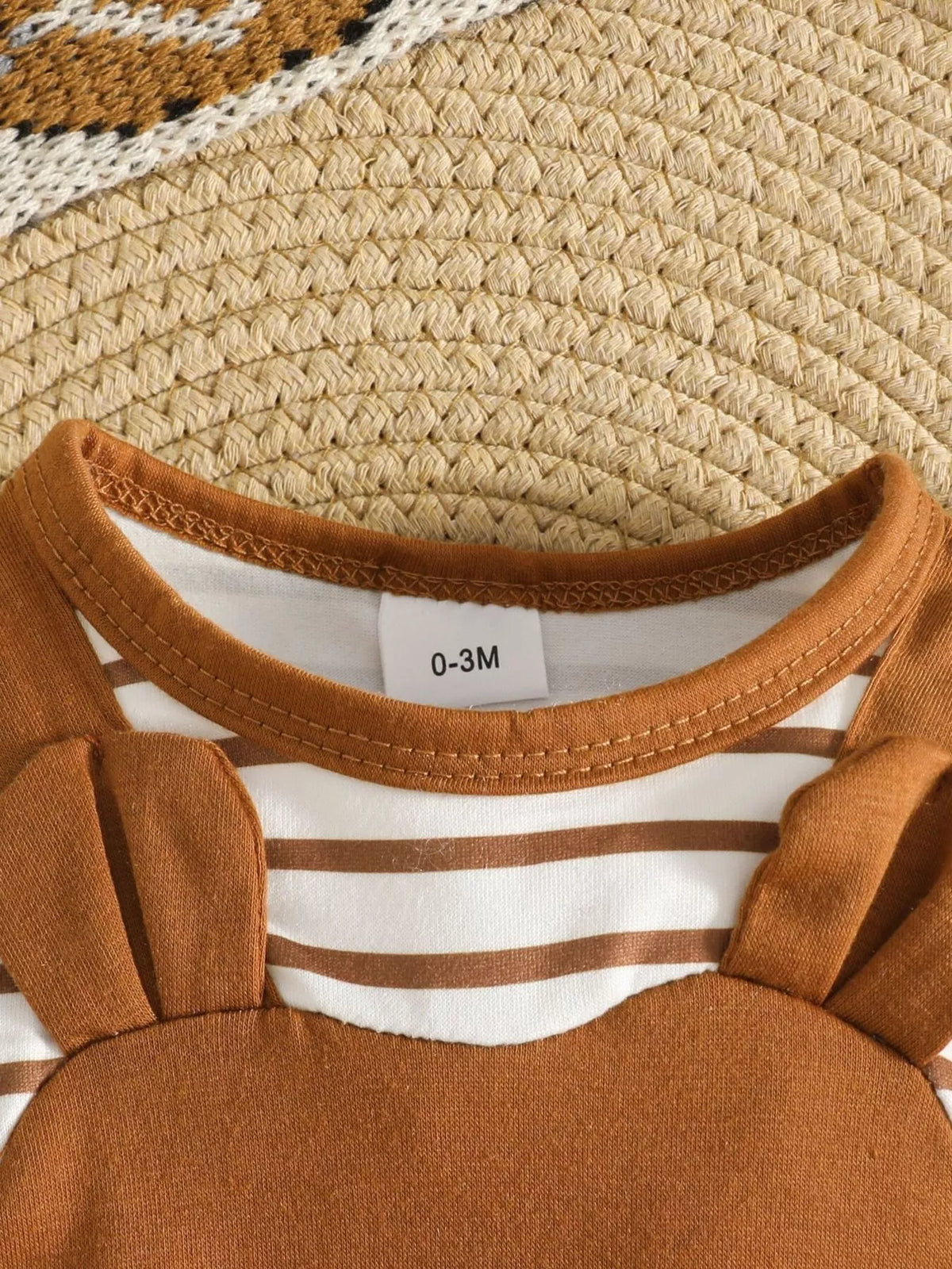 Brown bear jumpsuit with striped sleeves and hat — round neckline and striped upper