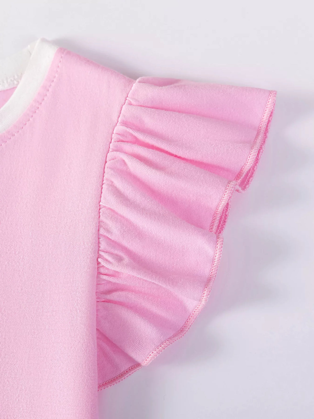 Gathered pink shoulder ruffle