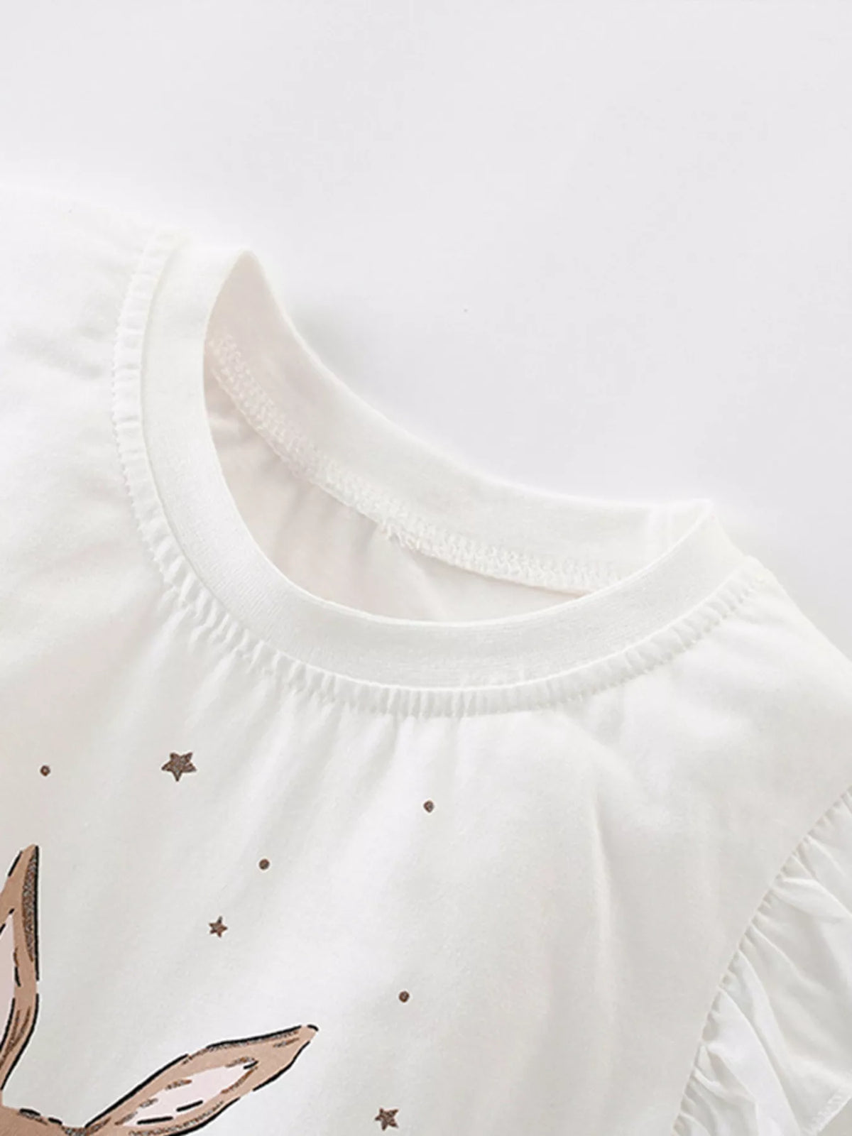 White ruffle sleeve bunny graphic shirt — round neckline and ruffle sleeve