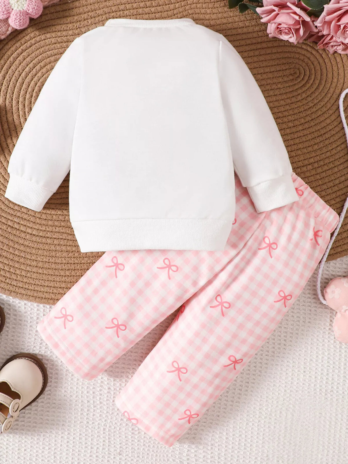 Back of the white sweatshirt and gingham pants