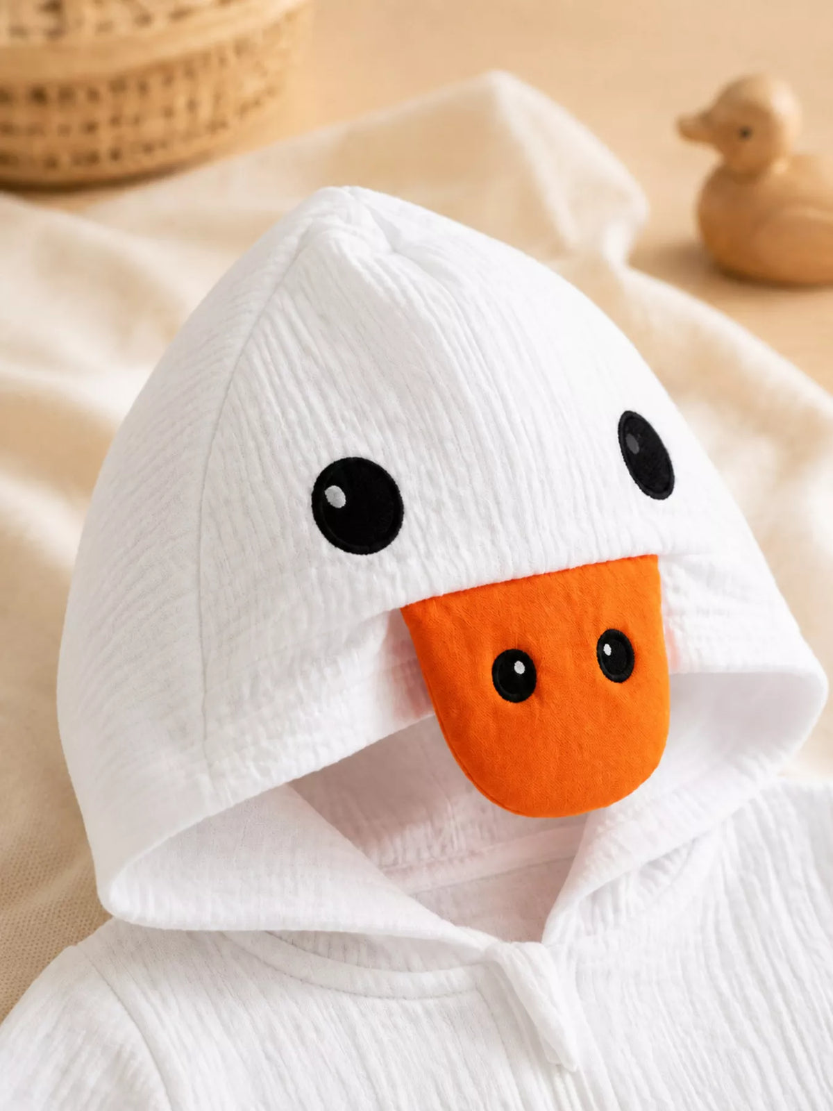 Baby Duck Hooded Bodysuit — duck-face hood detail