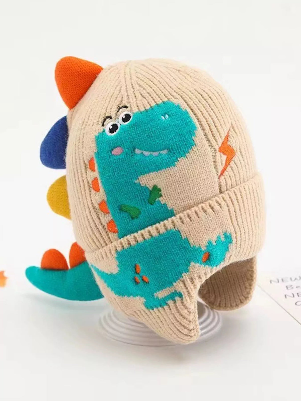 Dinosaur Knit Hat with Earflaps — beige hat side view