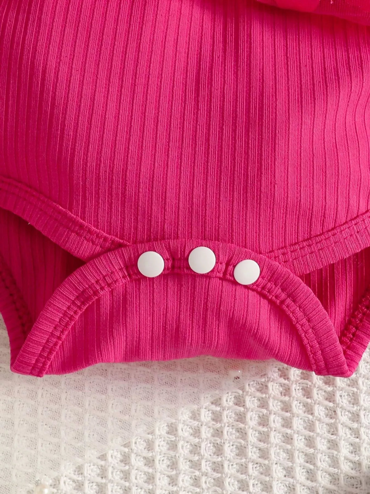 Fuchsia ribbed ruffle bodysuit and bow headband — bodysuit bottom snaps