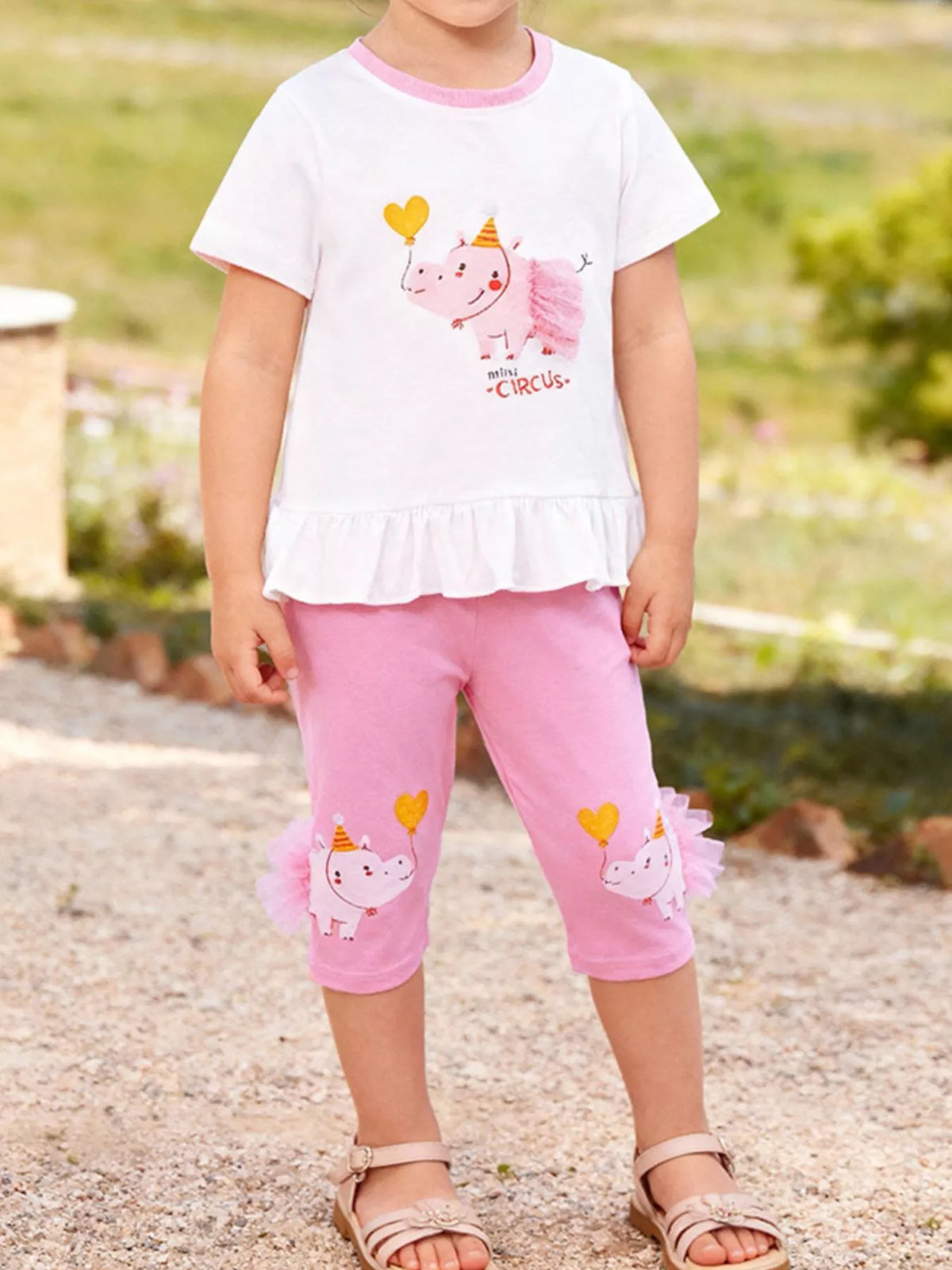White ruffle-hem circus tee with pink capri leggings on a child
