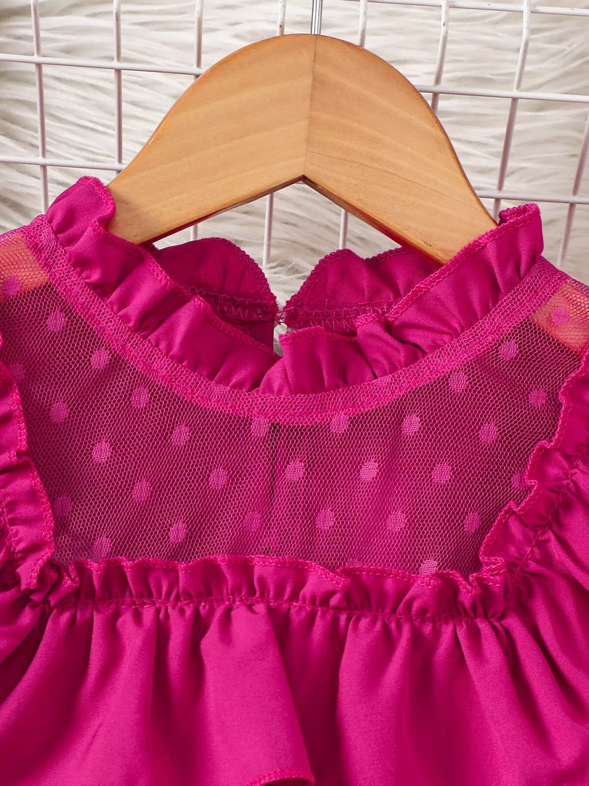 Fuchsia ruffled neckline and dotted mesh yoke