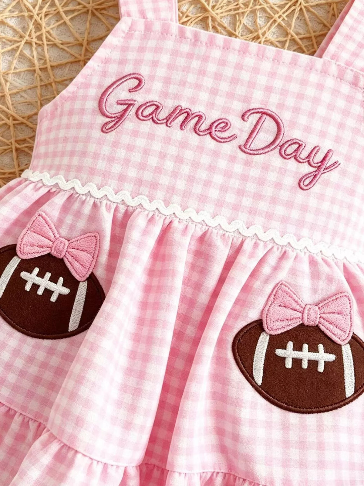 Gingham peplum top with football appliques