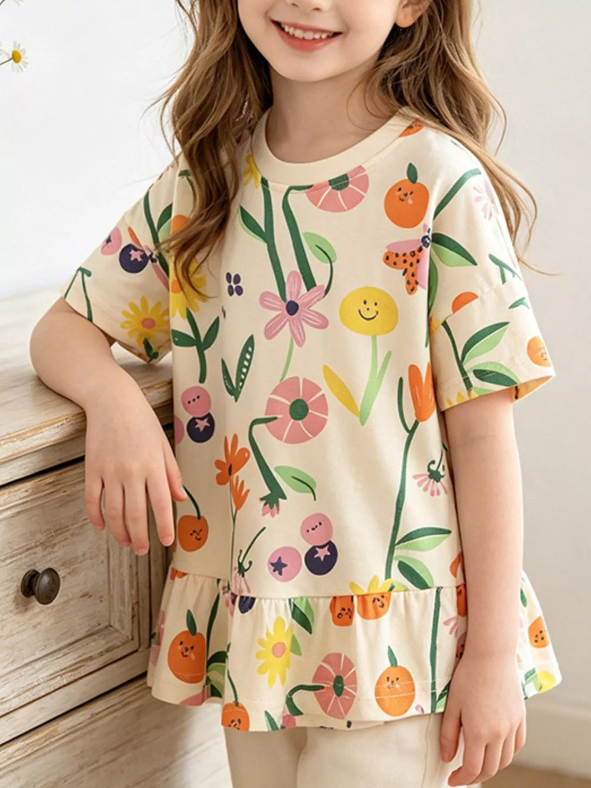 Cream floral fruit ruffle hem shirt — shirt shown on child