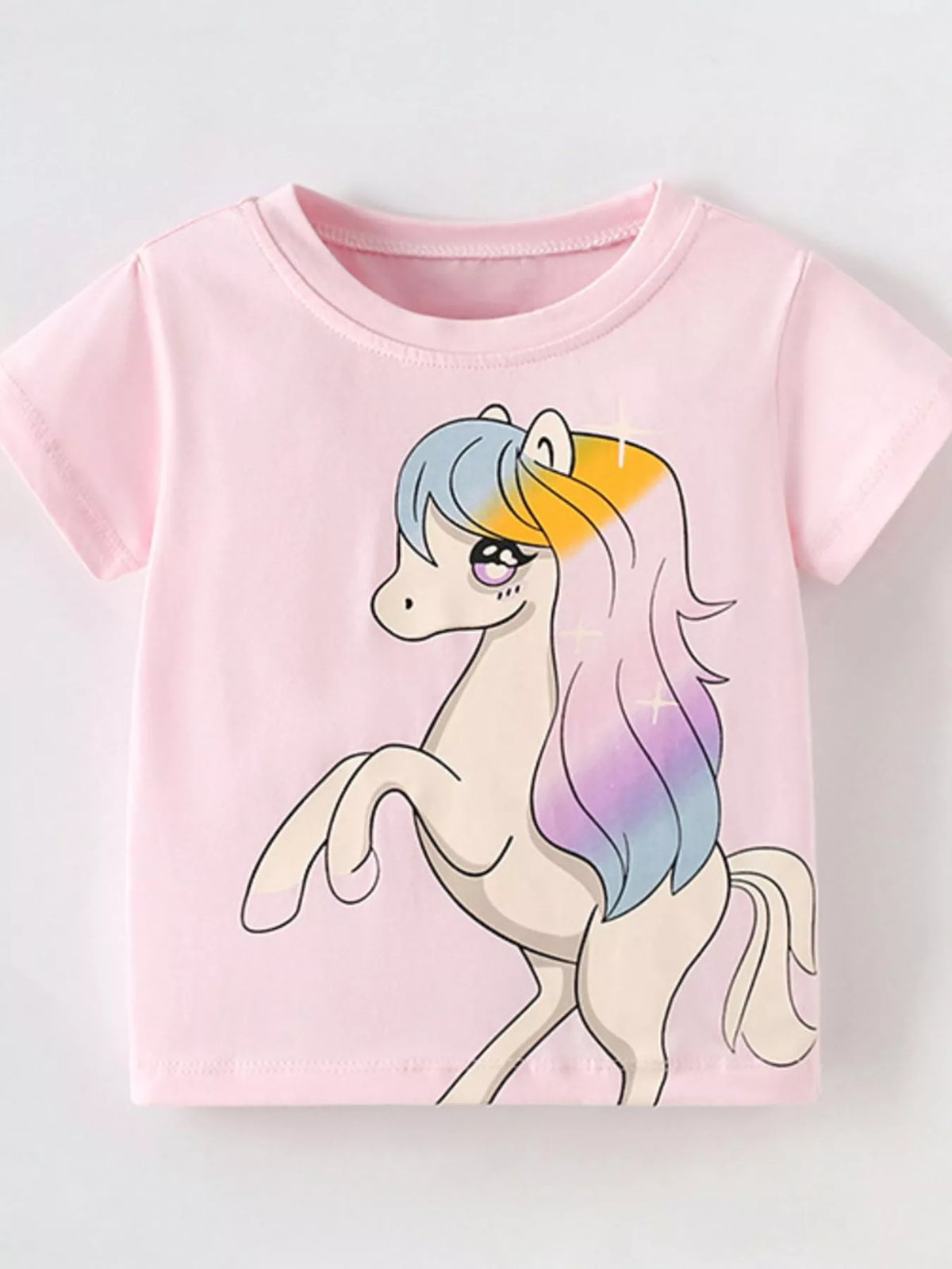 Pink unicorn graphic shirt — front