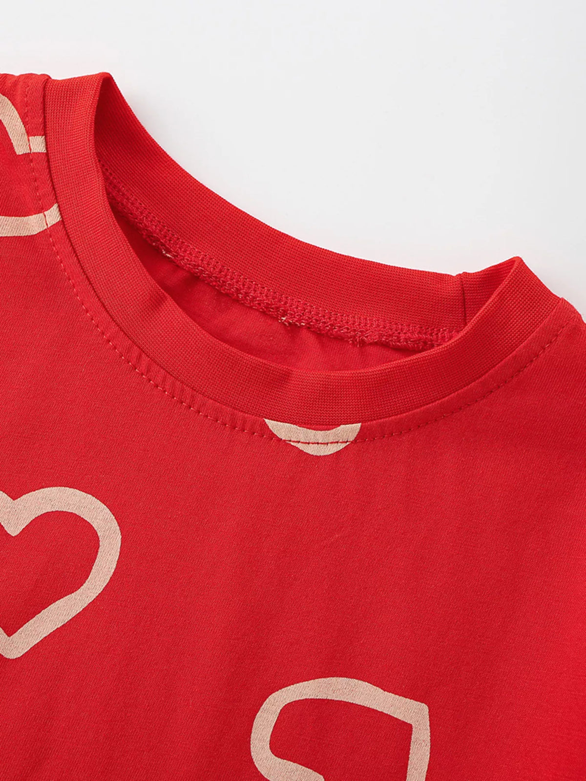 Red outline heart print shirt — round neckline