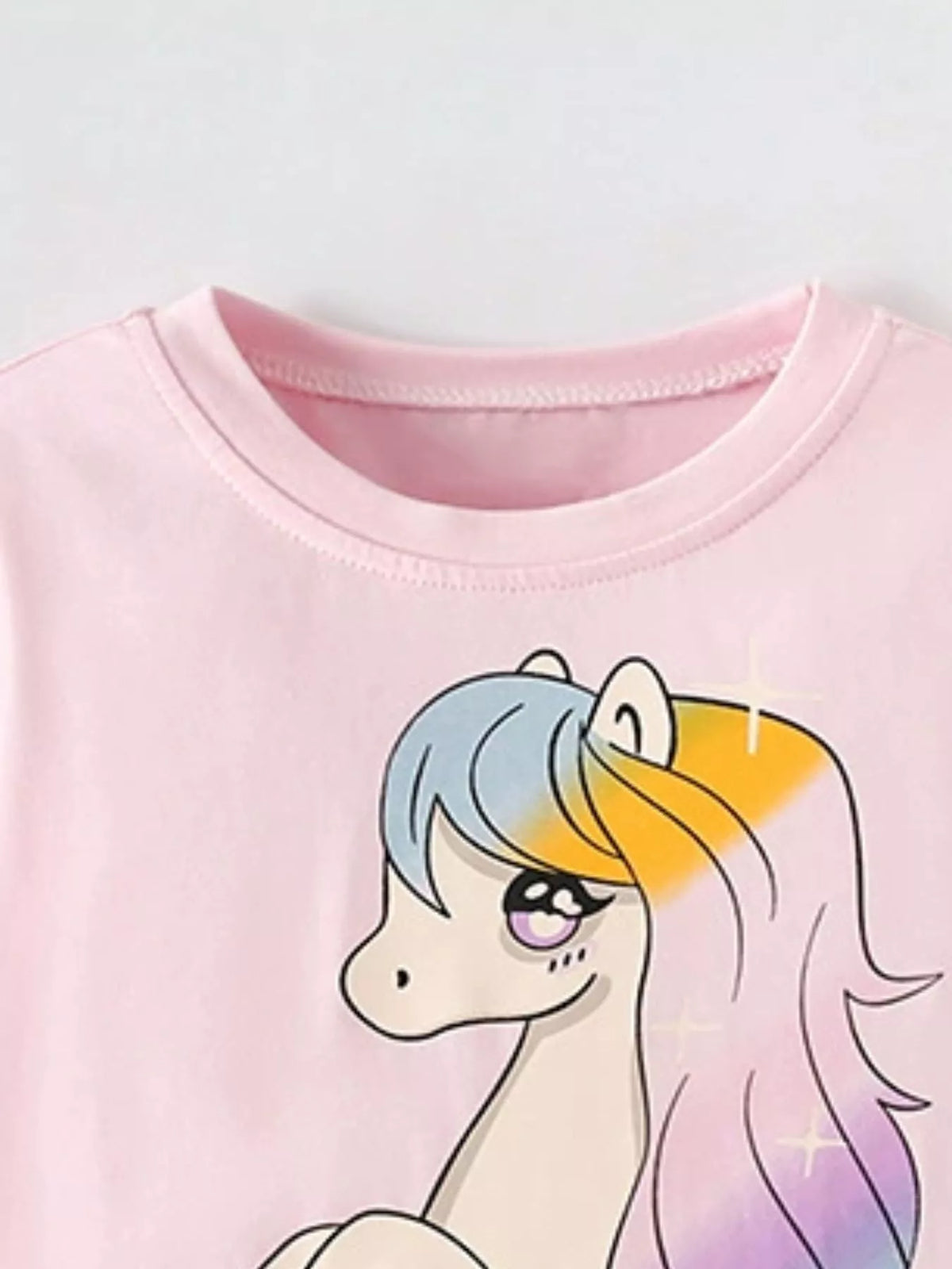 Pink unicorn graphic shirt — round neckline