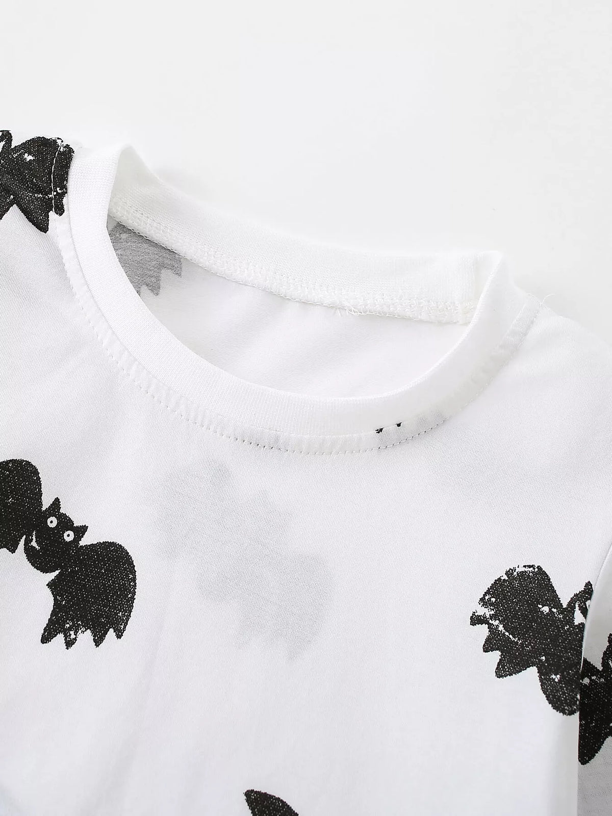 White round neckline and black bat motifs
