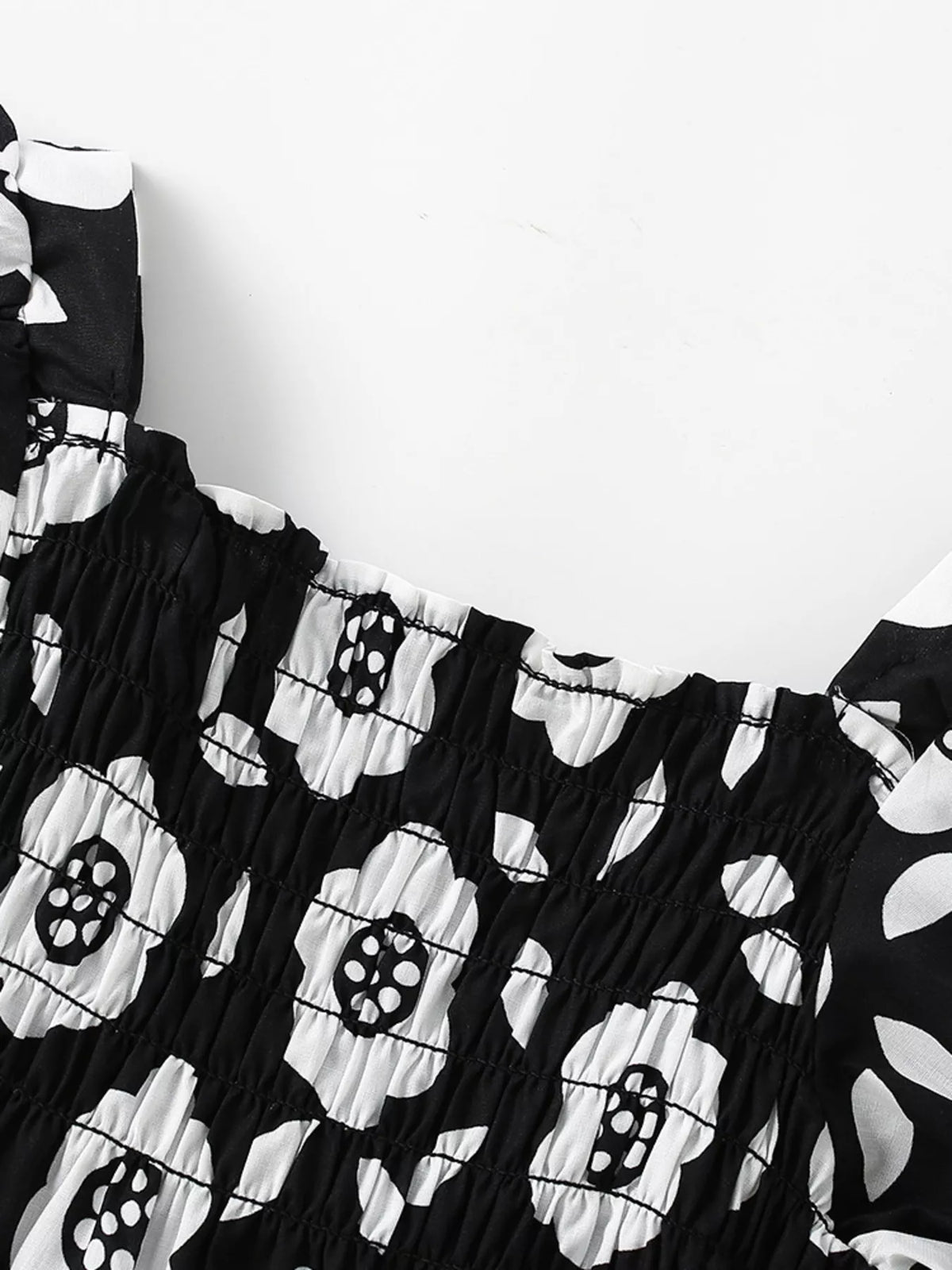 Smocked square neckline with white floral print